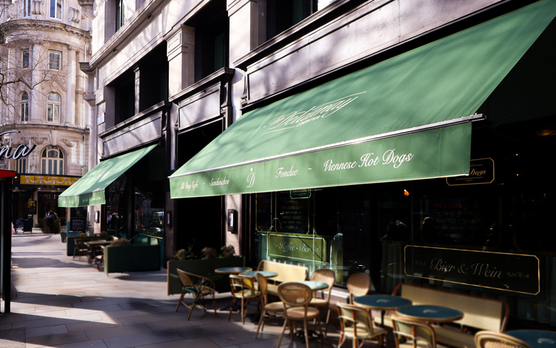 Victorian awnings in Covent Garden refreshed with new green covers and cream branding