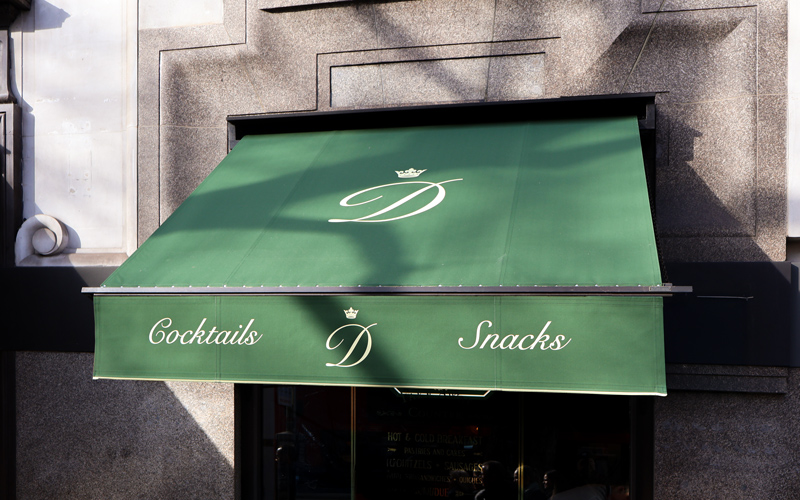 Victorian awnings in Covent Garden refreshed with new green covers and cream branding